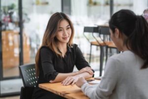 young woman meeting her friend at a cafe to discuss fentanyl addiciton treatment