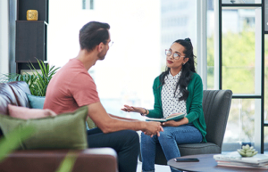 female therapist discussing suboxone treatment with young man